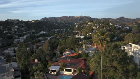 Hollywood-Hills,-Los-Angeles,-Residential-Neighborhood-and-Landscape-Under-Famous-Sign,-Aerial-View