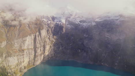 Aerial-Top-View-of-Mountainside-Oeschinen-Lake-in-Switzerland-Alps-Region,-Oeschinensee-Lake-Scenery