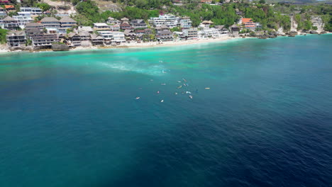 Group-Of-Surfers-Wait-For-The-Next-Wave-Off-Bingin-Beach-Indonesia