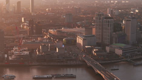 Rising-aerial-shot-of-Waterloo-bridge-and-roundabout-London-at-sunrise