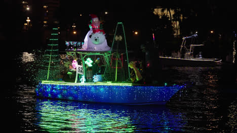 Festive-Boat-Float-with-Lights-at-Christmas-Boat-Parade-in-Tampa,-Florida