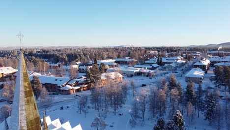 Arvidsjaur-in-winter,-revealing-church-with-frozen-tower,-Lapland