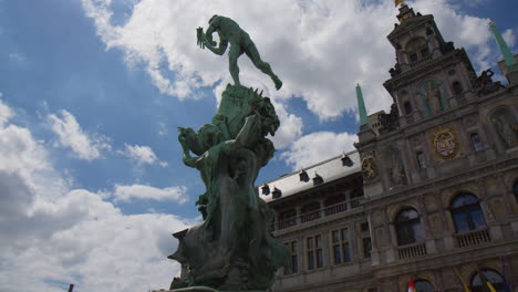 The-Brabo-Monument-Stands-in-Front-of-Antwerp's-City-Hall-in-Belgium---Low-Angle-Shot