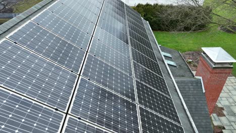 Slow-flight-over-solar-panels-installed-on-roof-in-american-neighborhood