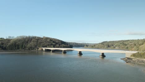 Sunlit-Youghal-Bridge-spanning-River-Blackwater,-County-Cork,-Ireland,-on-a-clear-day