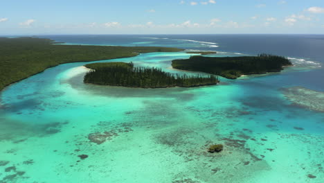 Small-islands-in-picturesque-Oro-Bay-in-New-Caledonia-on-the-Isle-of-Pines---aerial-flyover