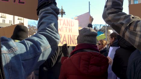 People-holding-signs-at-demonstration-against-Russian-war-in-Ukraine