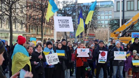 Protesters-hold-flags-and-signs-against-Russian-invasion-of-Ukraine