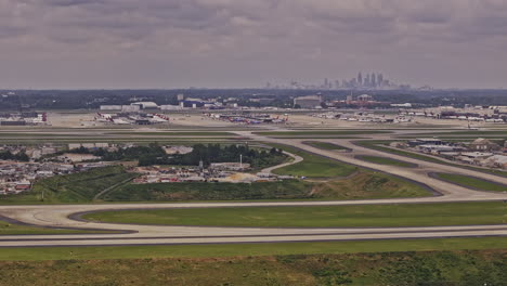 Atlanta-Georgia-Aerial-v941-zoomed-drone-flyover-College-Park-and-Hapeville-capturing-South-Cargo-site-at-ATL-Hartsfield-Airport-with-cityscape-on-the-skyline---Shot-with-Mavic-3-Pro-Cine---May-2023
