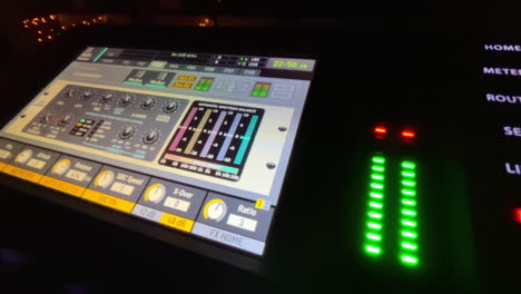 Close-Up-of-Behringer-X32-Sound-Mixer-Board-with-Active-Audio-Levels-in-Use-at-Event