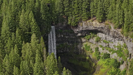 Brandywine-Falls-BC-Canada-Aerial-v6-slowmo-drone-flyover-provincial-park-capturing-lush-forests,-creek-waterfalls-over-a-rugged-cliff-into-a-deep-rocky-canyon---Shot-with-Mavic-3-Pro-Cine---July-2023