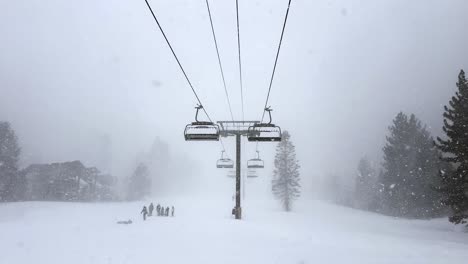 Empty-Chairlifts-in-a-Heavy-Blizzard-Snowstorm-in-Mammoth,-Sierras