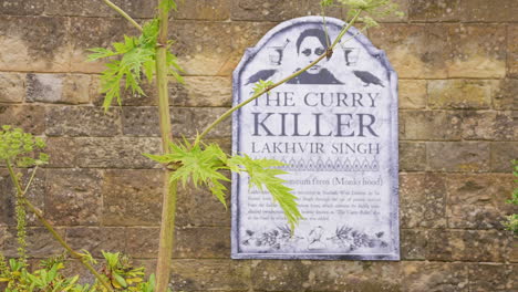 The-Curry-Killer,-Lakhvir-Singh-Sign-Board-in-The-Poison-Garden,-Alnwick,-England-UK