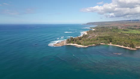 Aerial-View-Of-North-Shore-Beaches-With-Kawailoa-Wind-Farm-In-The-Background-In-Oahu,-Hawaii,-USA