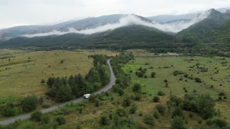 RV-Camper-Motorhome-drives-in-Central-Balkan-National-Park,-Bulgaria---Aerial-4k