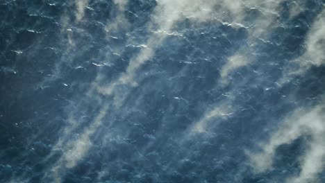 Birds-Eye-View-Of-Mist-And-Fog-Being-Swept-Over-Water-In-Norway