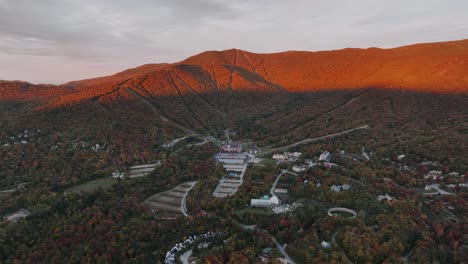 Aerial-View-Vermont-Mountain-Ski-Resort-And-Clay-Brook-Hotel-And-Residences-At-Sunset-In-New-England,-US