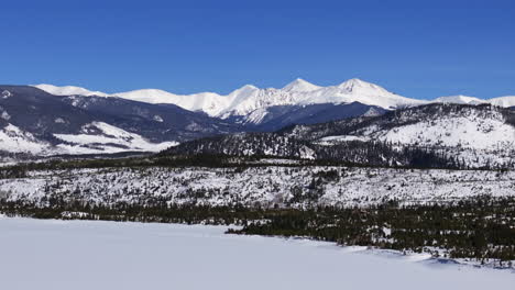 Snowy-winter-bluebird-bluesky-cold-Colorado-aerial-drone-frozen-Lake-Dillon-Frisco-Silverthorne-Keystone-Breckenridge-landscape-view-Grays-and-Torreys-fourteener-i70-circle-left-slowly-motion