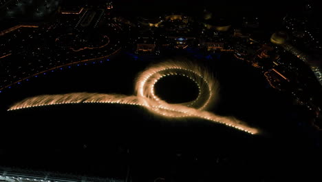 Aerial-view-overlooking-the-illuminated-Bellagio-fountain,-night-in-Las-Vegas,-USA
