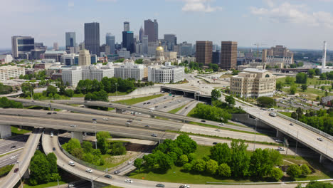 Aerial-of-Atlanta-Ralph-David-Abernathy-Freeway-with-Georgia-State-Capitol-government-office-and-Downtown-Atlanta-skyline-buildings-and-skyscraper-in-view,-Georgia,-USA