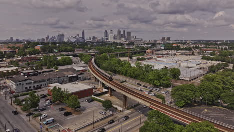 Atlanta-Georgia-Aerial-v932-flyover-West-End-and-Adair-Park-towards-Castleberry-Hill-capturing-train-in-motion,-highway-traffic-and-south-and-downtown-cityscape---Shot-with-Mavic-3-Pro-Cine---May-2023
