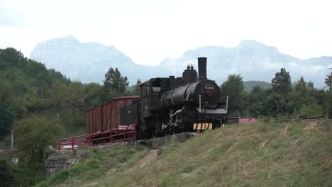 Train-in-bosnia-and-herzegovina-bosnian-train-cars-on-hill-stock-footage