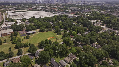Atlanta-Georgia-Aerial-v981-birds-eye-view,-flyover-Adair-park-residential-neighborhood-and-the-Met-business-center,-tilt-up-view-of-cityscape-on-the-skyline---Shot-with-Mavic-3-Pro-Cine---August-2023