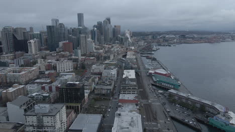 Aerial-shot-of-Seattle-pier-and-downtown-skyline-panning-right