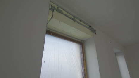 Parallax-shot-of-isolating-a-window-lintel,-parallax-shot-indoors