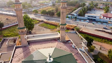 Aerial-view-of-roof-and-minaret-towers-of-Banjul-Central-Mosque-and-St-Augustine's-School,-Gambia
