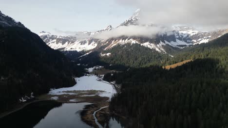 Obersee-Glarus-Switzerland-aerial-of-the-clouds-surrounding-mountain