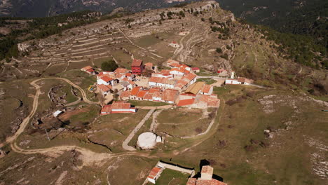 Aerial-View-of-Coratxà-Top-Hill-Small-Village-in-Spain,-Tinença-de-Benifassà-Area-in-Valencian-Community-Region