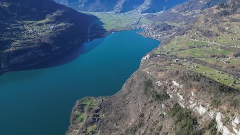 Amden-Weesen-Switzerland-lake-view-tilt-up-to-see-tourist-village-in-mountains