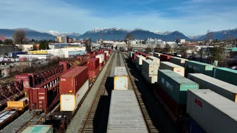 Flying-Over-Intermodal-Containers-On-Freight-Train-In-Vancouver,-BC,-Canada