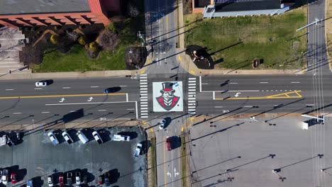 Rising-drone-shot-of-Austin-Peay-State-University-logo-painted-on-street-outside-campus