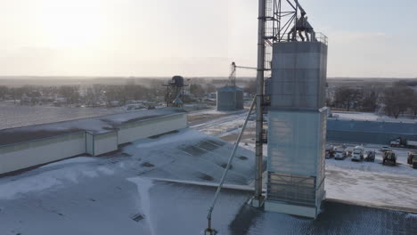 Aerial-View-of-Snow-Covered-Fertilizer-Plant-Beside-Agricultural-Farm-Field