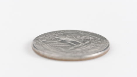 Silver-Dollar-Coin-With-Eagle-Engraved-On-White-Table