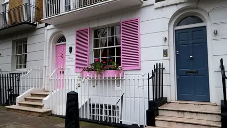 White-house-with-pinks-doors-and-shutters-in-14-Trevor-Square,-London
