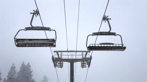 Empty-Stationary-Empty-Ski-Lift-Chairs-Swinging-in-a-Heavy-Blizzard-Snowstorm