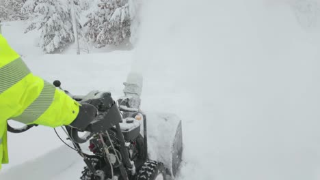 Snow-Removal-Works,-A-Worker-With-Snowblower-In-Action-In-Deep-Snow-Landscape