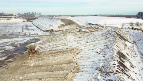 A-dozer-spreading-melting-ice-for-it-to-better-thaw-and-prevent-pooling-water
