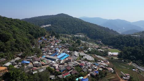 Slow-motion-drone-view-over-rural-mountain-village-in-northern-Thailand