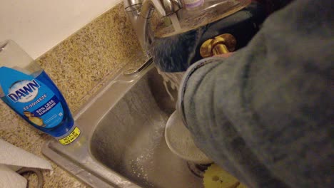 Washing-Dishes-in-Sink-