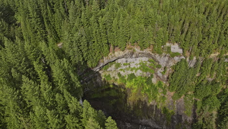 Brandywine-Falls-BC-Canada-Aerial-v8-slow-motion-flyover-provincial-park,-waterfall-over-the-wall-of-volcanic-rocks-into-a-deep-canyon-surrounded-by-forests---Shot-with-Mavic-3-Pro-Cine---July-2023