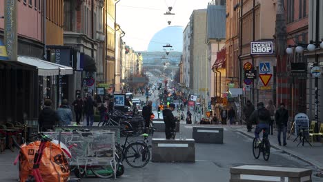 Static-centered-view-of-busy-street-Gotgatsbacken-in-Stockholm,-Sweden