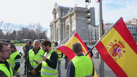 Spanish-farmers-and-agricultural-unions-gather-at-Plaza-de-la-Independencia-square,-also-known-as-Puerta-de-Alcalá,-in-Madrid-to-protest-against-unfair-competition-and-agricultural-policies