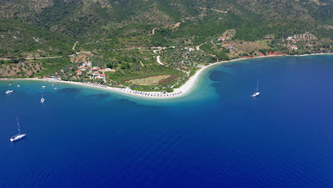 Aerial:-Slow-panning-drone-shot-of-Agios-Dimitrios-beach-with-amazing-and-turquoise-crystal-clear-water-in-Alonnisos-island,-Greece