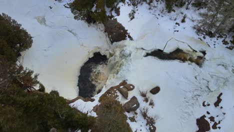 Amazing-high-view-of-frozen-waterfall-middle-in-forest-of-North-Minnesota
