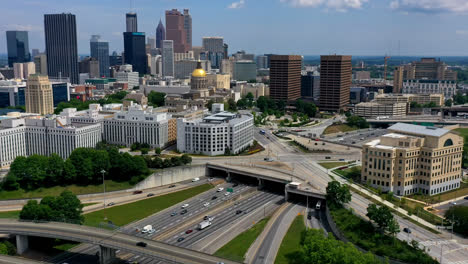 Timelapse-of-Atlanta-Ralph-David-Abernathy-Freeway-with-Georgia-State-Capitol-government-office-and-Downtown-Atlanta-skyline-buildings-and-skyscraper-in-view,-Georgia,-USA