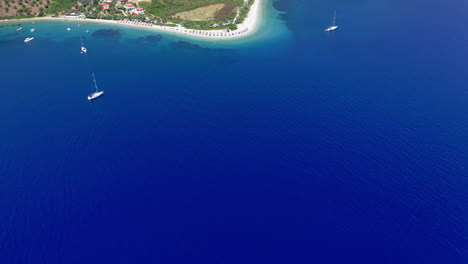 Aerial:-Reveal-shot-of-Agios-Dimitrios-beach-in-Alonnisos-island,-Greece